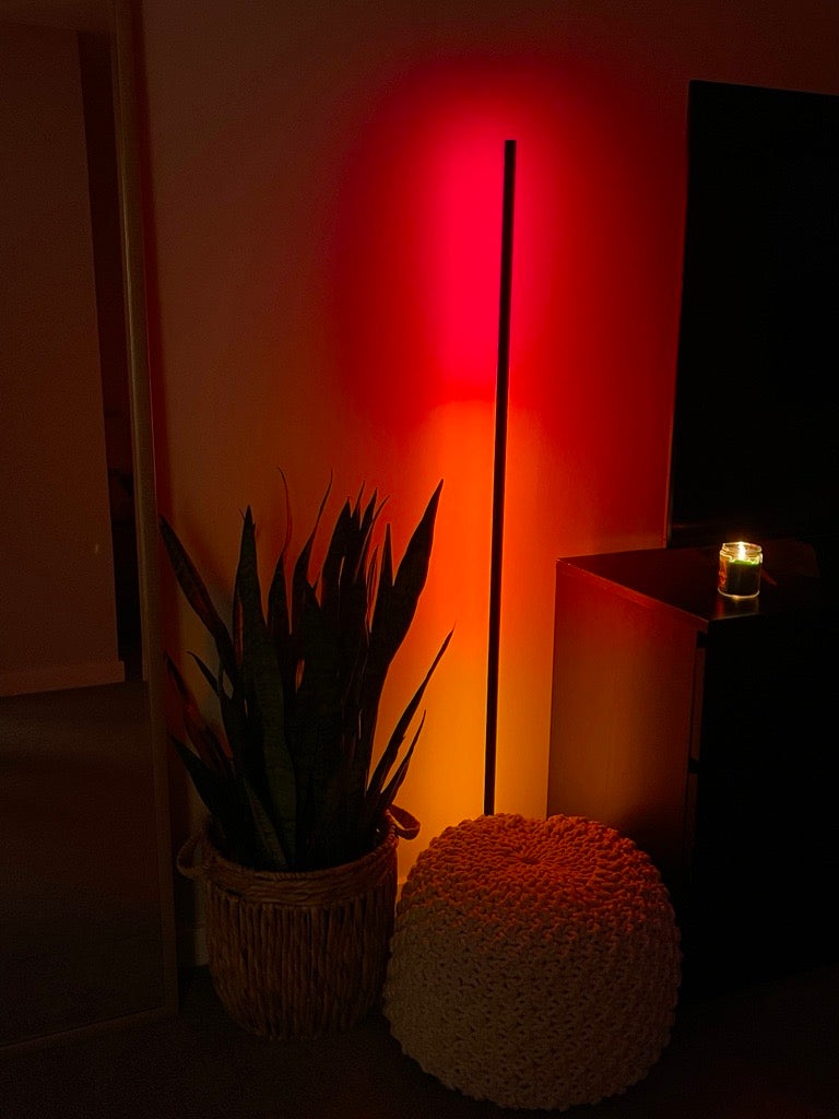 Image of a Luna Red Luminaire lighting a dimly lit room