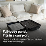 TrueLight Energy Trism folded to 12 x 12 x 1.25 inches inside a carry-on suitcase
