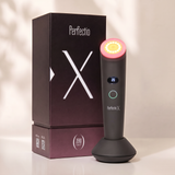 Perfectio X red and infrared light therapy wand with its retail box on a warm studio backdrop