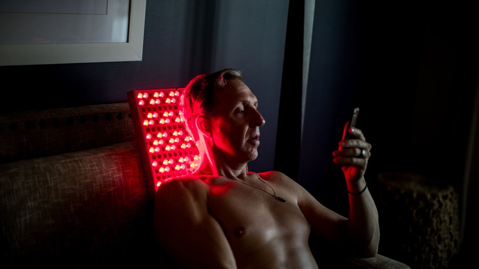 Dave Asprey using a TrueLight red light therapy panel